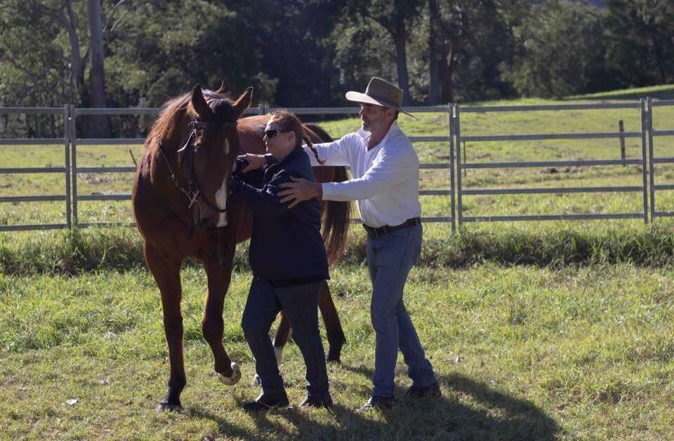 Scott teaches Georgie horsemanship in the documentary. Picture by Michael Booth