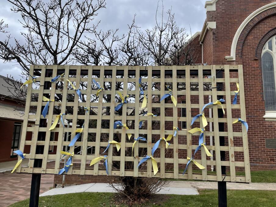 Blue and yellow ribbons are a symbol of solidarity. Picture: Briannah Devlin