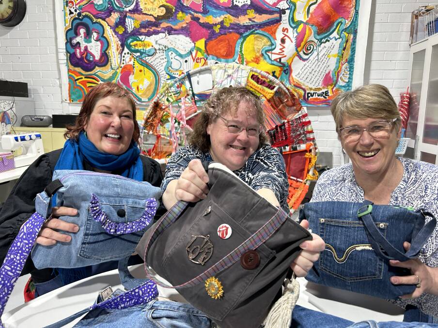 Creative Space Southern Highlands team leader Tania McInnes, Sewing: Your Style course graduate Sarah Prince and Moss Vale TAFE teacher Nola Peters with the bags they created. The course aims to give people confidence sewing and expand their skills for employment. Picture supplied 