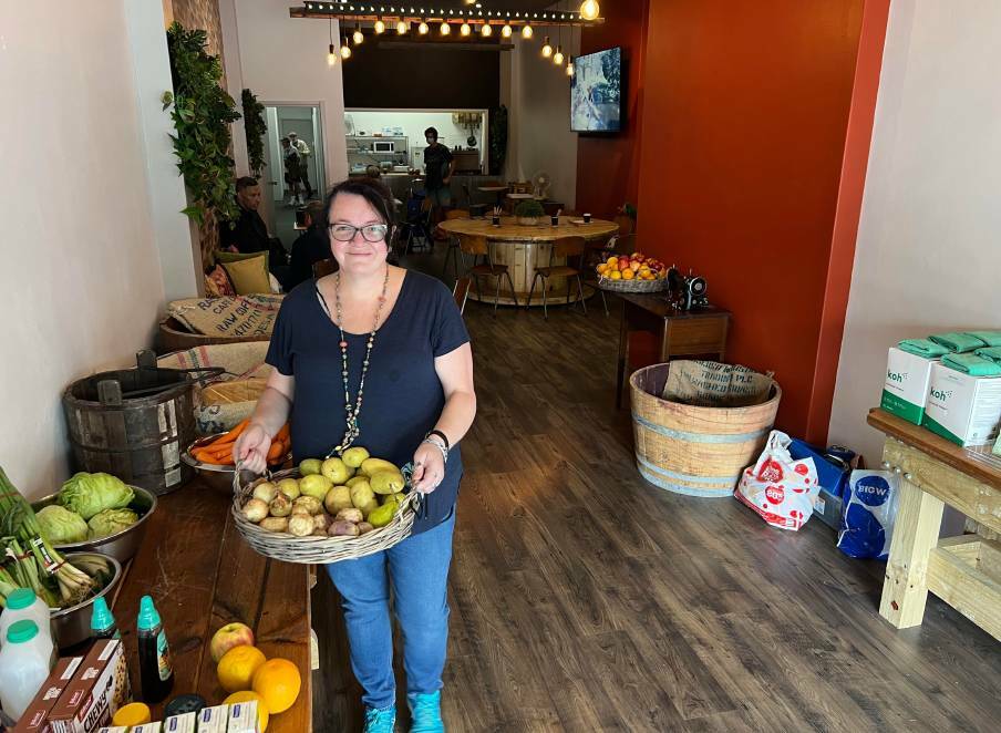 Coordinator of C3 Cares Rebecca Traynor with some of the available produce in their new space on Bong Bong Street. Picture: supplied
