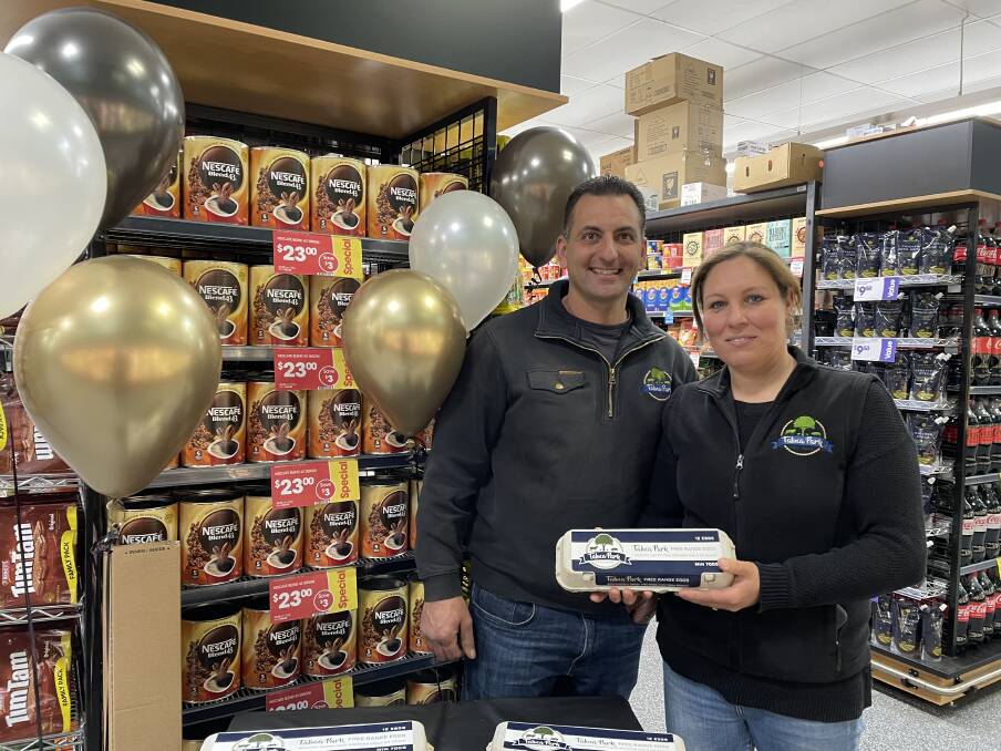 Frank and Anne-Marie Vigilante from Taluca Park celebrated the relaunch of the Moss Vale IGA store by telling shoppers about their free range eggs. Picture by Briannah Devlin