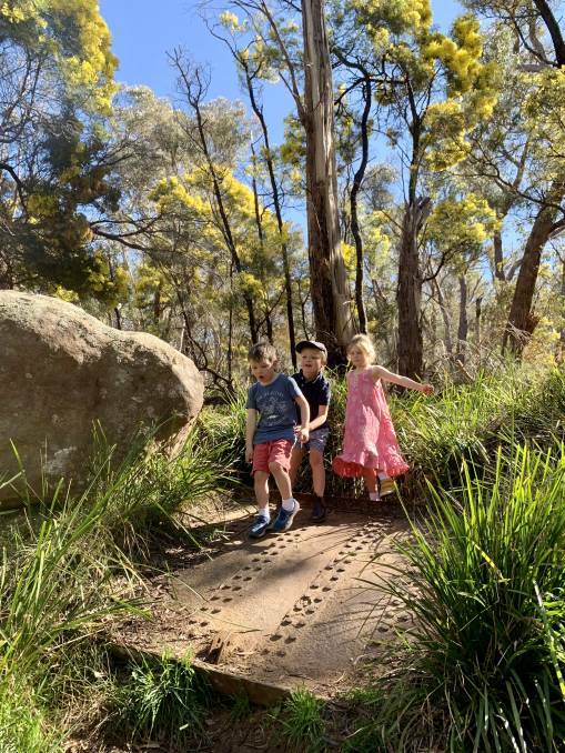 Christopher, 5, and Eliza, 7, and friend, George, 5, find fun and adventure in the great outdoors. Photo by Tanya Galwey
