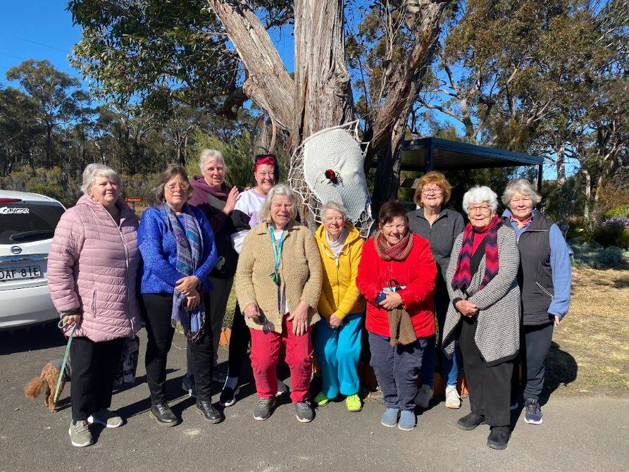 Elizabeth Cole, Susan Webb, Virginia Russell, Kirsty McLean, Jan Helsep, Maureen Kruss, Maryann Anderson, Kim Peterson, Marie Dyer and Suzanne Arnel came to see the yarn bombing at Yerrinbool Station. Picture by Brianah Devlin