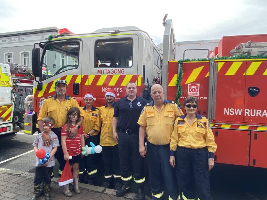 Mittagong RFS made sure Santa and Mrs Claus arrived safely and in style. Picture: Briannah Devlin