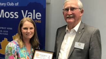 Moss Vale Public School principal Katherine Hurst receives a $14,000 cheque from the Rotary Club of Moss Vale President Malcolm Webber, which was raised through the annual Charity Golf Day. Picture supplied 