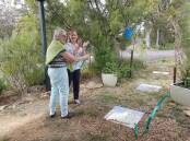 Yerrinbool Village Group publicity officer Jan Heslep with Member for Wollondilly Judy Hannan at the unveiling of the recycled pavers at the Yerrinbool Railway Garden. Picture supplied 