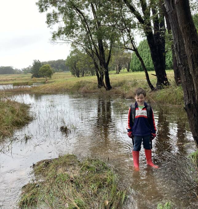 Christo Galwey loved exploring the puddles in early April in Berrima. Picture: Supplied 