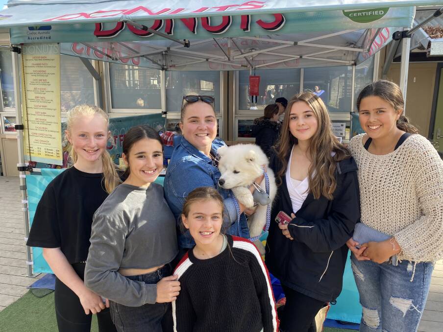 Former Berrima Public School students Charlotte Copus, Liv McMahon, Ellie Hunter and Ava Fitzgerald united with Year 5 and 6 teacher Crystal Howarth and current student Bella Copus at the market in May. Photo: Briannah Devlin. 