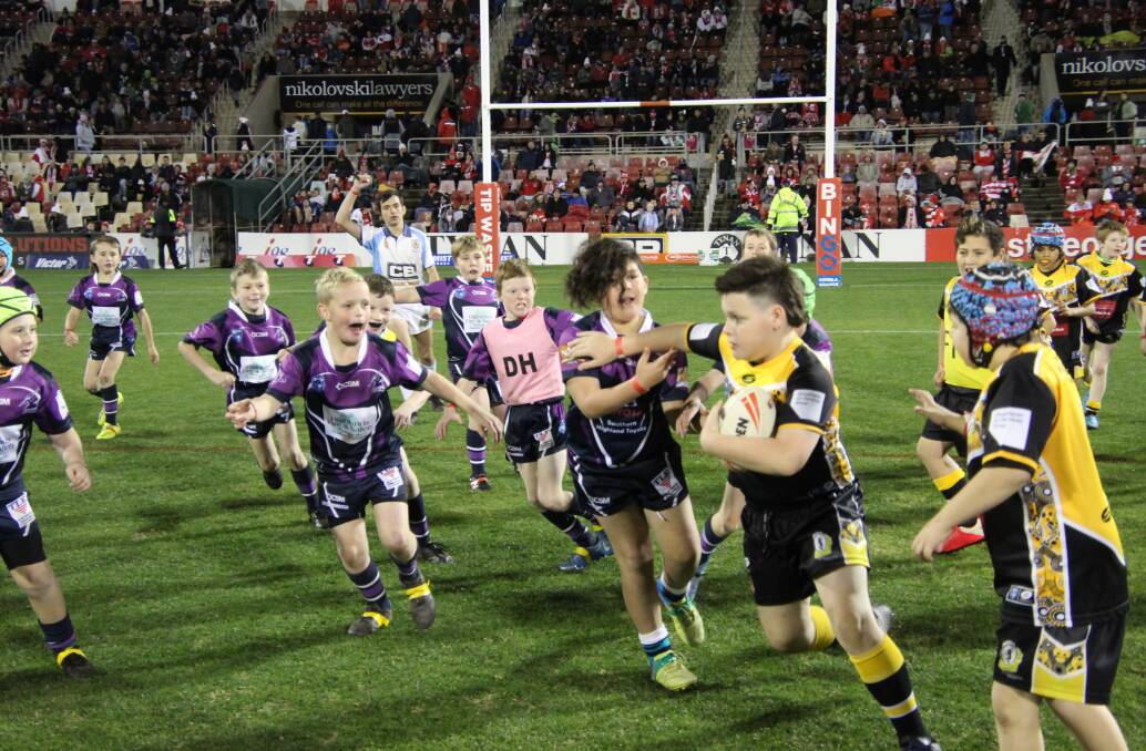 The u10s team played against the Nowra Warriors in a half-time match of a St. George Illawarra Dragons and Canberra Raiders game in June. Photo: Michael Galvin 