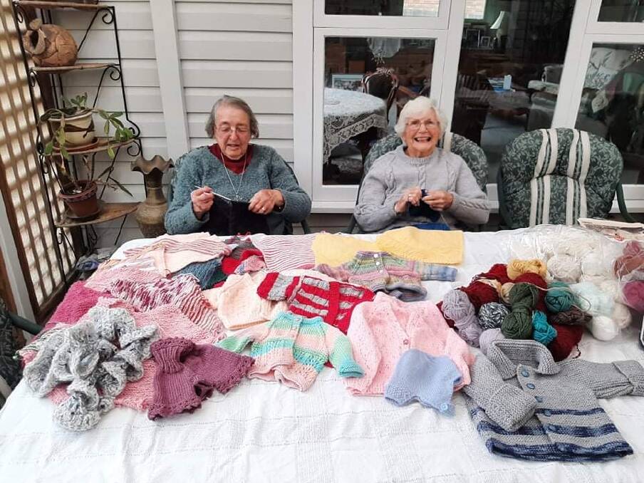 Shonagh Moore and Jenny Connolly gather with other women to make items for others. Photo: Dominic Unwin. 