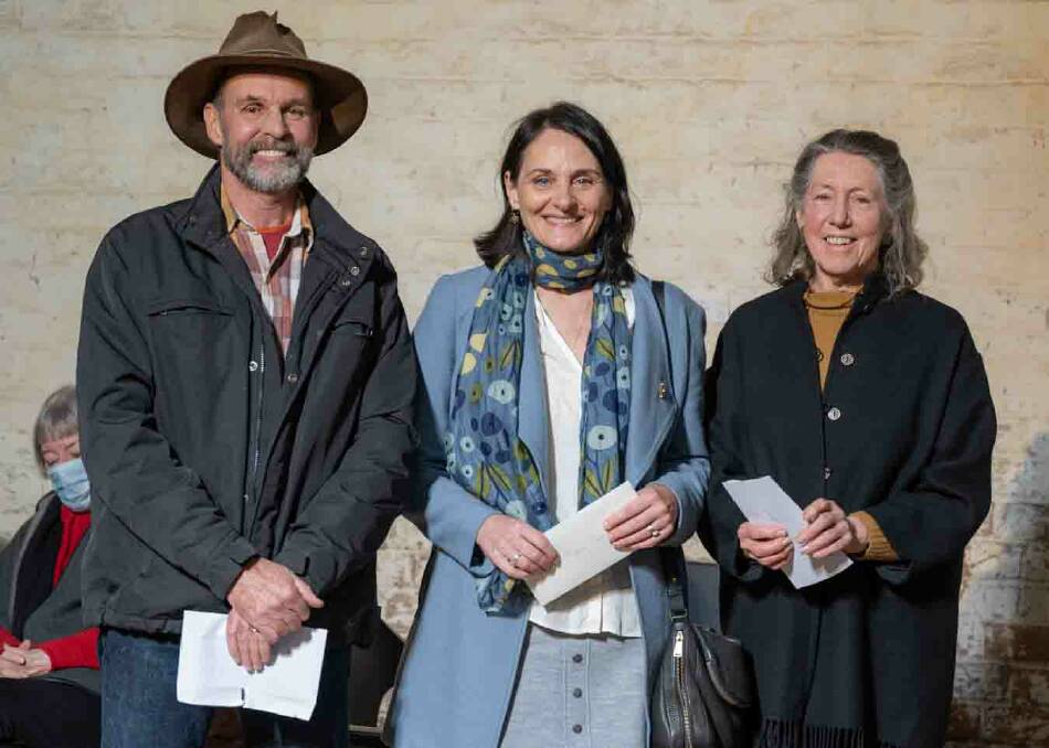 Judges Rick Shepherd (far left) and Beverly Allen (far right) stand with this year's Can Assist Southern Highland Botanical Art and Illustration Prize winner Angela Lober. Picture by John Swainston
