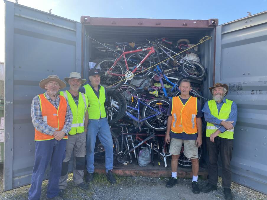 Greg Olsen, John Pearce, Hans Radowitz, Dick Boonham and Dave Johnson have worked together with others to pack bikes into shipping containers. Picture: Briannah Devlin 