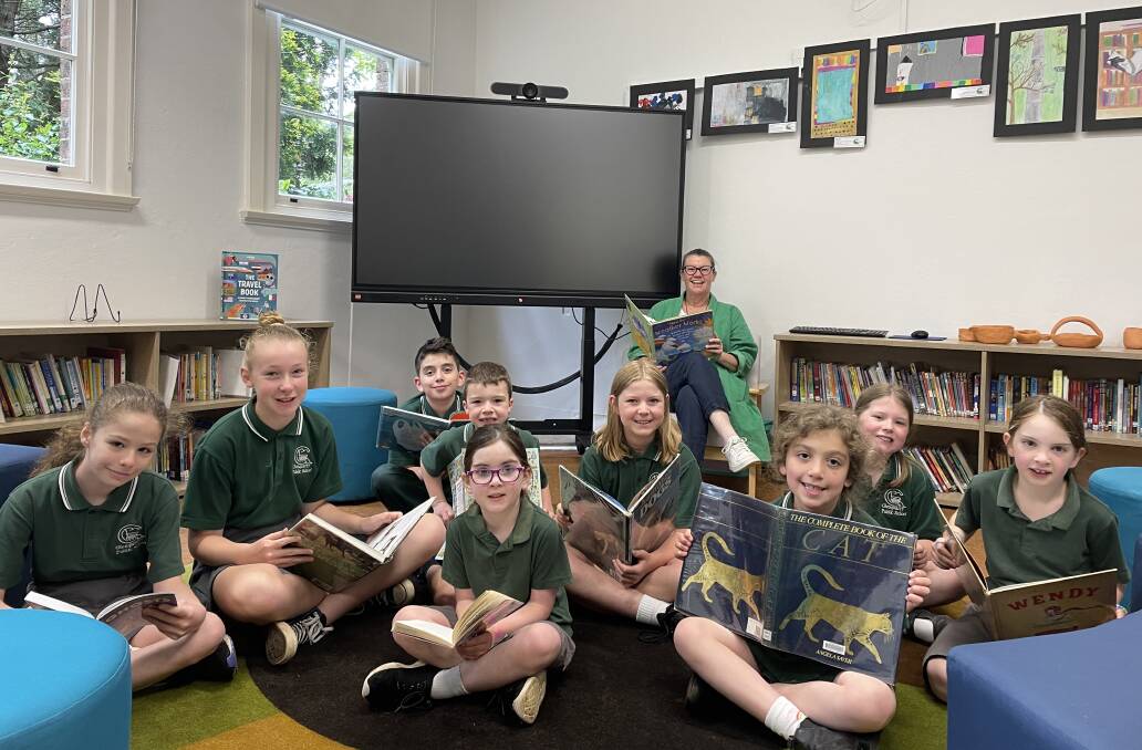 Lilla, Annabel, Zac, Rory, Bree, Amelia, Sophia, Lily Cora and Mrs O'Connor enjoy reading and learning in Glenquarry Public School's new and improved library. Picture by Briannah Devlin. 