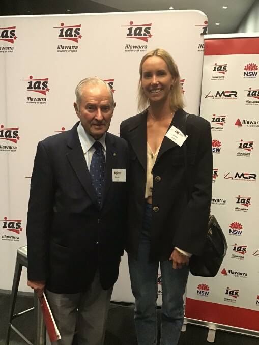 Former Highlands sports administrator and volunteer Gordon Lewis with Olympan Emma McKeon. Photo: supplied 