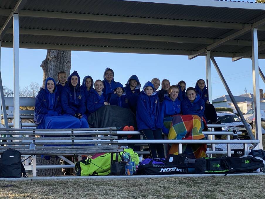 The girls try to stay warm in freezing conditions in Lithgow. Photo: Supplied