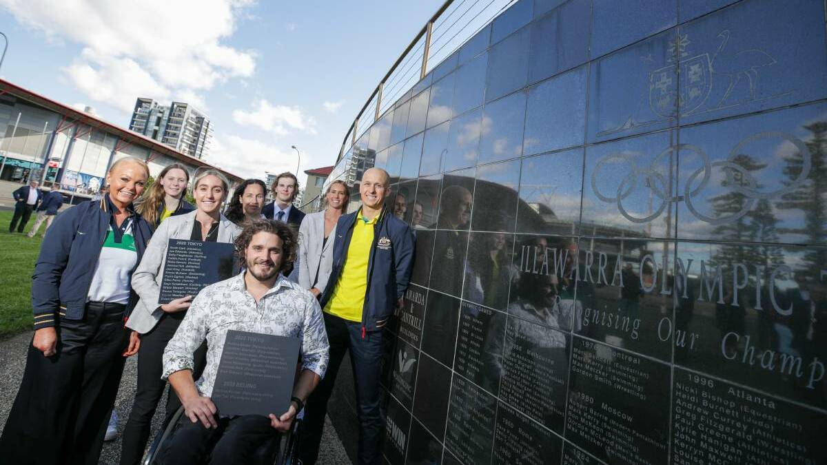 Sam Tait (front) and Melissa Perrine (fourth from right) have had their names added to the Olympians and Paralympians Wall in Wollongong. Photo: Adam McLean