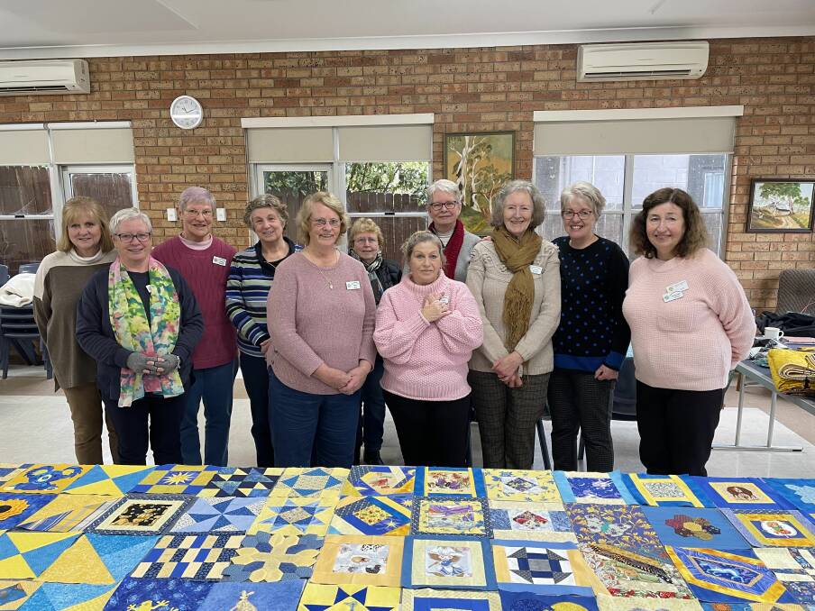 Members of the Southern Highlands Quilters Guild have been hard at work knitting squares for the Ukraine war effort. Photo: Dominic Unwin