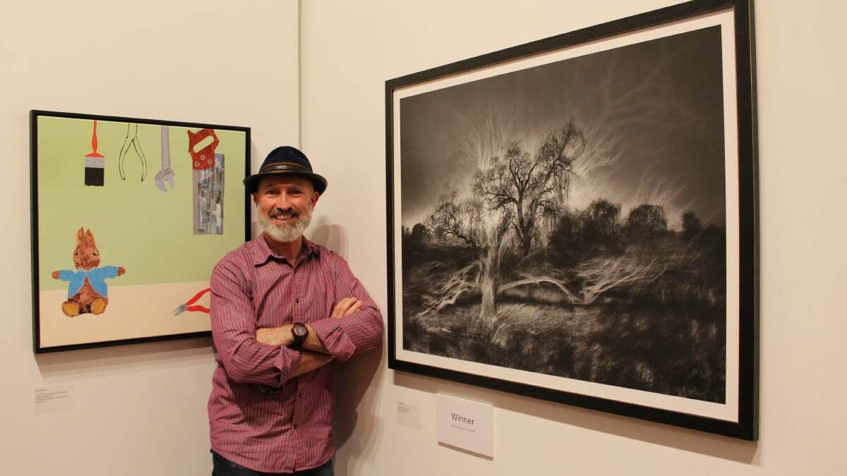Mark Kelly of Mittagong, winner of the (open section) Goulburn Art Award for 2018 with his photographic print, Ghosts of the past. It was one of the last awards open to the public before COVID-19. Photo: Ainsleigh Sheridan