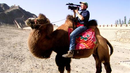 ONE HUMP OR TWO: Veteran filmmaker Michael Dillon films from the back of a camel.