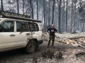 Rosedale resident Jack Egan and the remains of his house after the Black Summer Bushfires