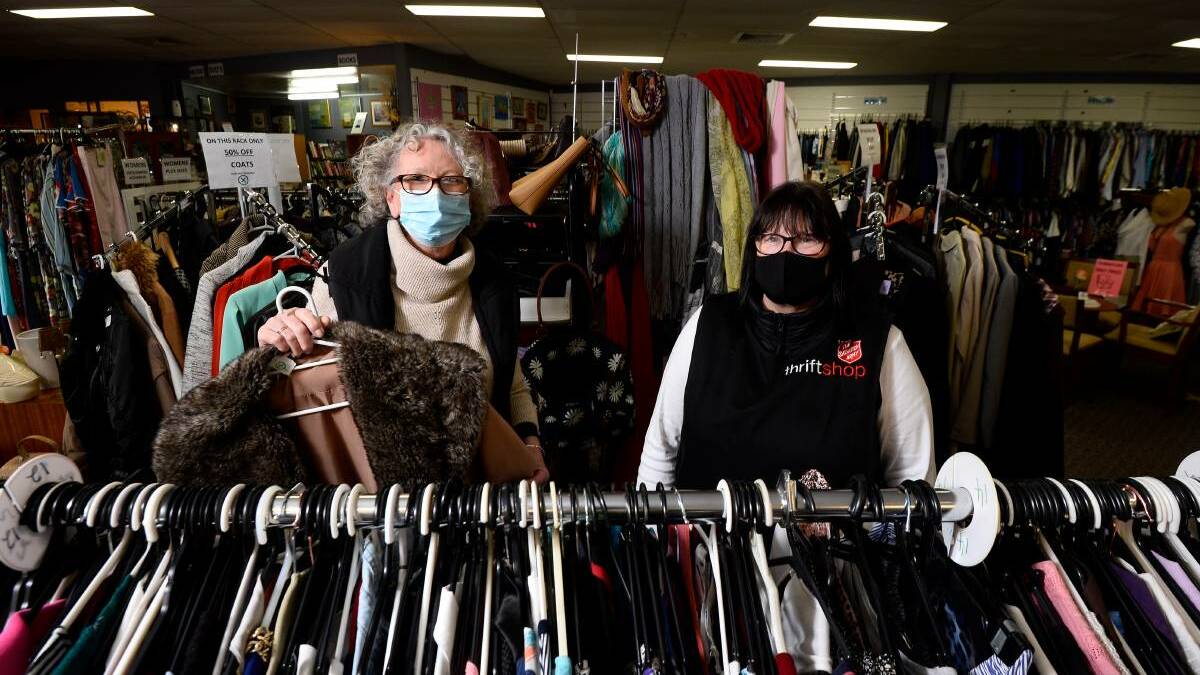 Volunteers Marie Lyons (left) and Diane Lindsay at a Salvation Army thrift shop. Picture: Adam Trafford 