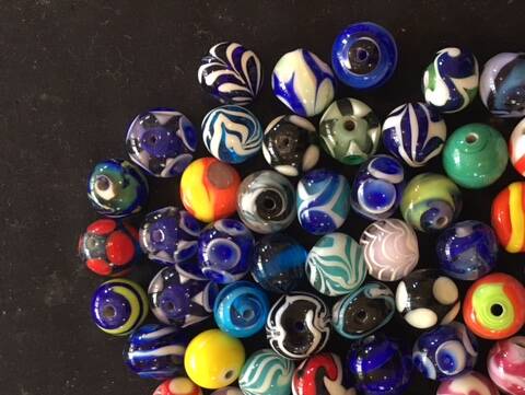 Judy Dyson creates colourful glass beads. Picture: Supplied.