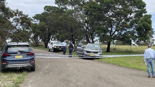 Police tape off the property at the end of Hazleton Road at Bungonia. Picture Burney Wong