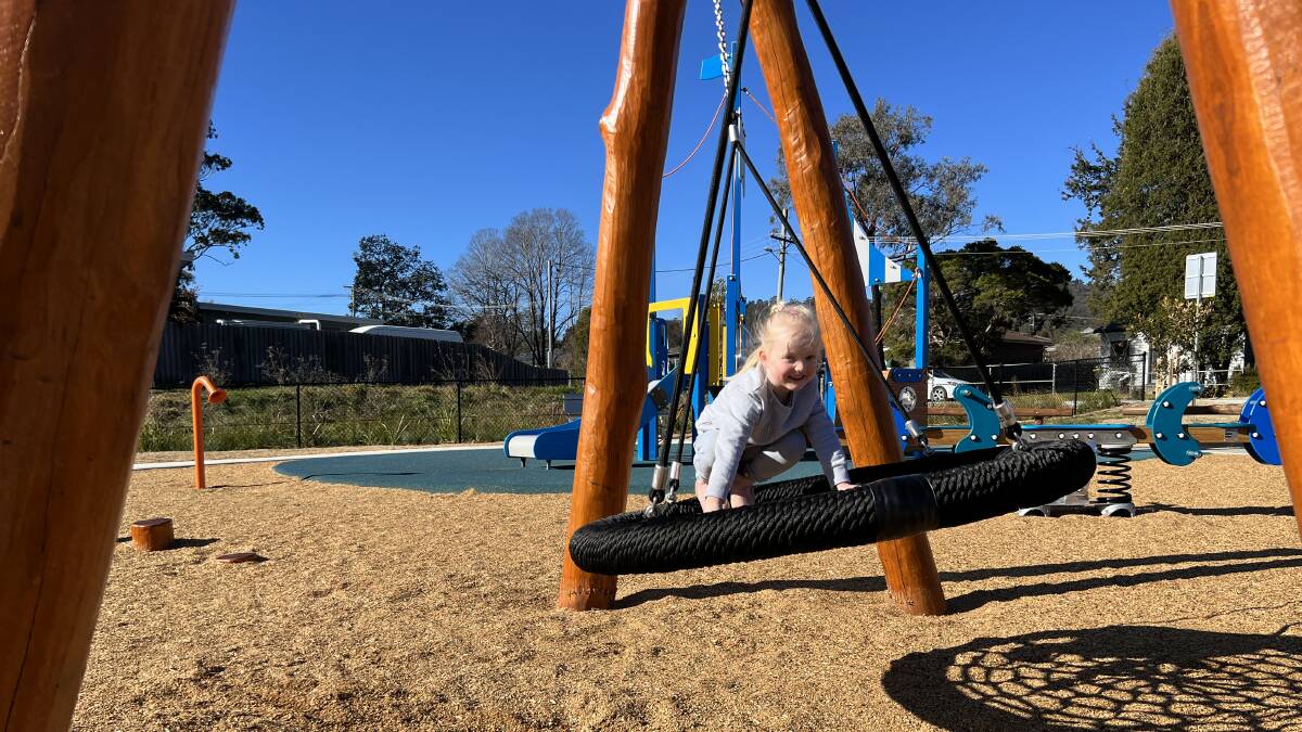 Four-year-old Acelyn Holland says the swings are her favourite part of the Cook Street Park in Mittagong. Picture by Sally Foy.