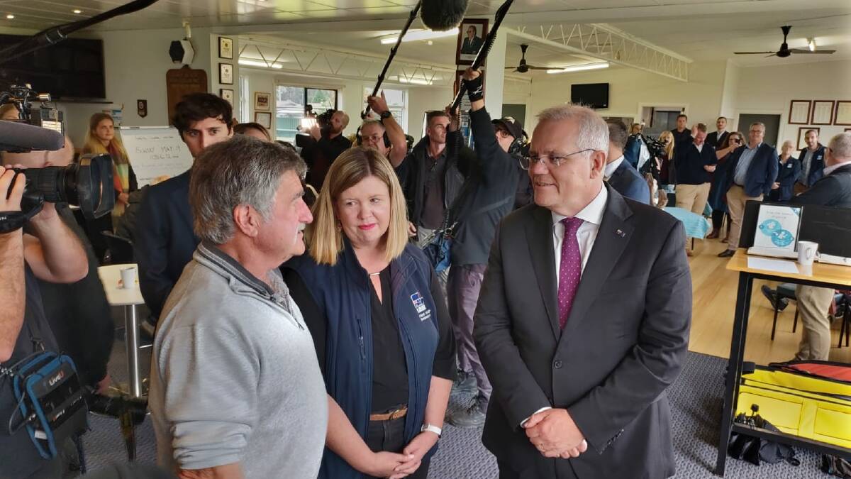 Mick Savage, left, with the Liberal MP for Bass Bridget Archer and Prime Minister Scott Morrison. Picture: Steve Evans