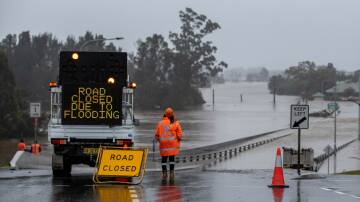 A flooded road in Windsor, New South Wales. Picture: Getty Images