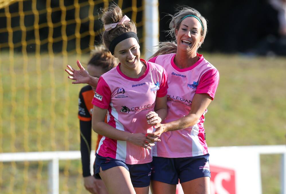 ON TARGET: Chloe Middleton (left), pictured here celebrating in a past game with teammate Caitlin Cooper, scored two goals for the Stingrays on Sunday night. Picture: Adam McLean