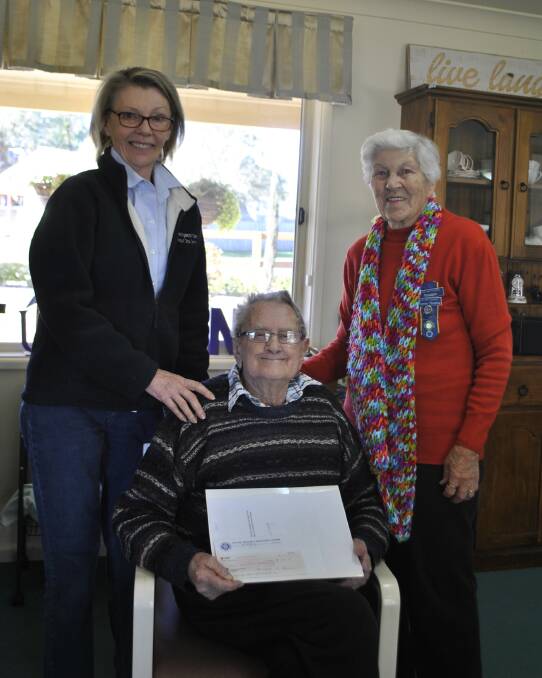 THANK YOU: Maureen Fleming (right) from the Mittagong CWA presents a cheque of $500 to service manager Helen Denning and client Ron McLaughlin of Wingecarribee Adult Day Centre. Photo: Charli Shield.