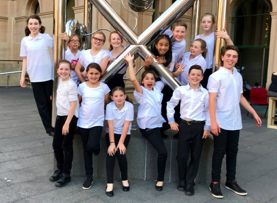 The St Paul's Catholic Primary School choir members: (top left to right) Sarah Reynods, Molly McKeon, Henriette Hayman, Poppy Luker, Ayessa Cecilo, Charlie Woolfrey, Kate Darch, (bottom left to right) Rachael Grosvenor, Jade Moses, Isabella Stewart, Aaliyah Berry, Flynn Casely and Zach Moses. Photo: Supplied. 