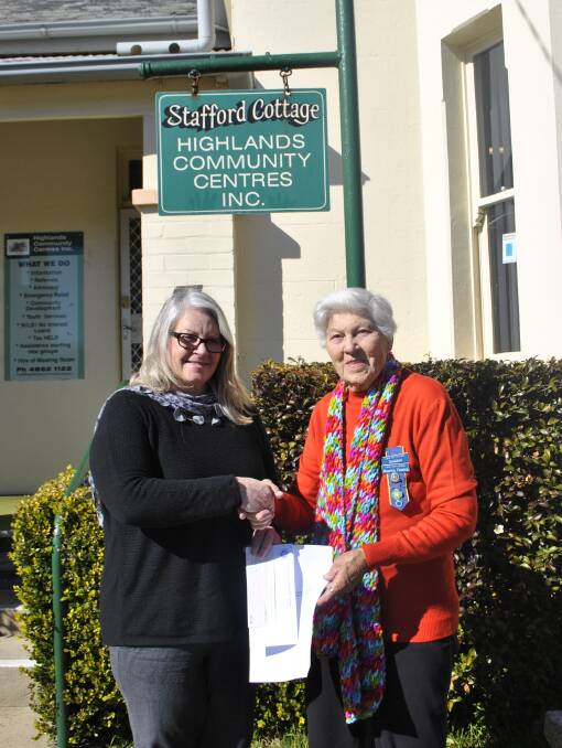 Mittagong CWA's Maureen Fleming presents a cheque of $500 to Suzi Kenney, Manager at Stafford Cottage. Photo: Charli Shield. 
