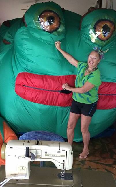 SEW BIG: Evelyn at home with one of her Nylon Zoo creations - a giant inflatable frog. Photo: Facebook.