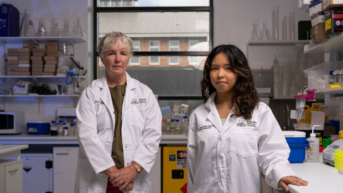 Rebecca Davey and Dr Chelisa Cardinez in a research lab at the John Curtin School of Medical Research. Picture by Jamie Kidston