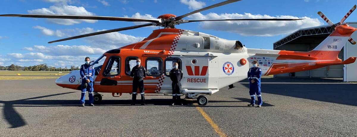 ADDITIONAL RESOURCE: The surge helicopter, pictured with Dr Brian Burns, Mike de Winton, Michael Legge and Matt Moore will be based in Dubbo. Photo: CONTRIBUTED