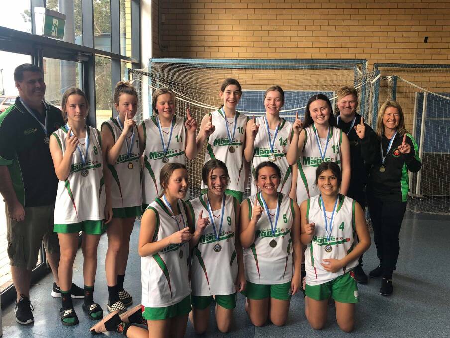 The under 16, Moss Vale Magic division two girls squad defeated Tamworth in a thrilling 40-36 victory to become champions. Photo supplied