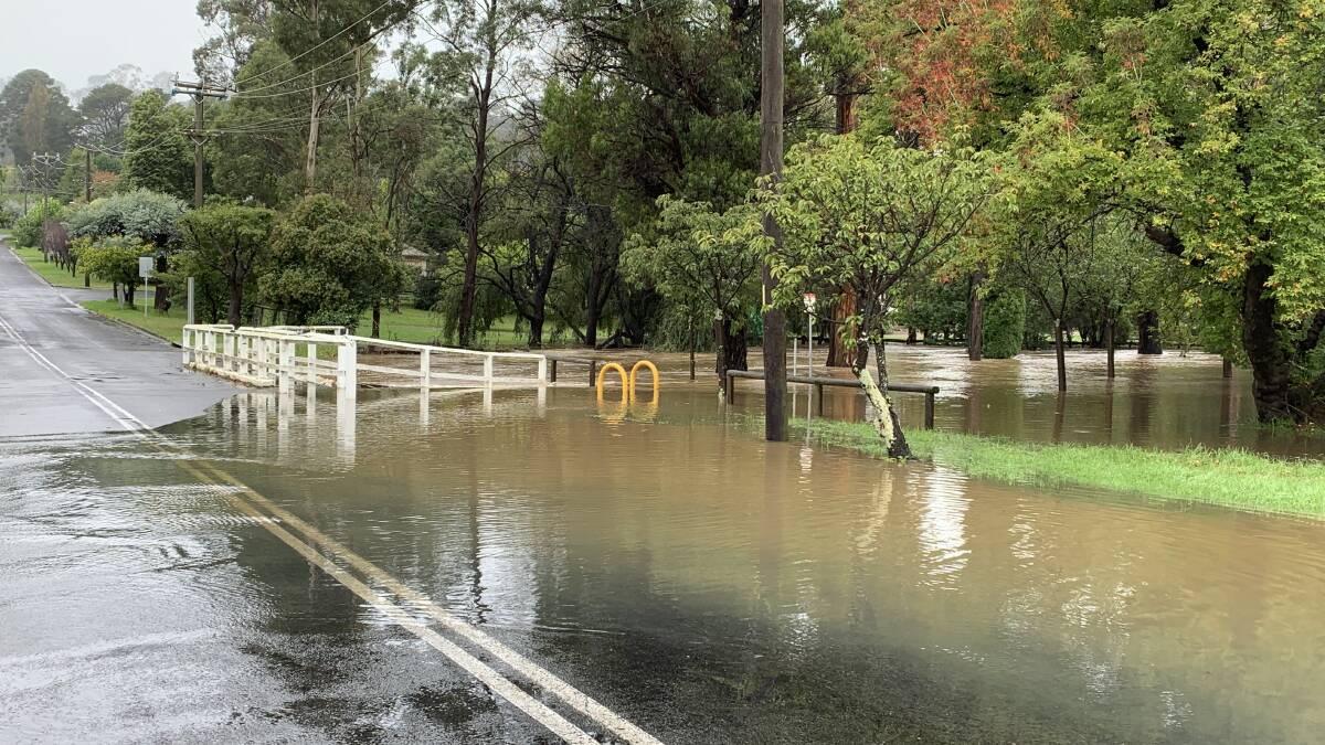 Mittagong Creek nearly overflowing on Shepherd Street, caution issued for drivers