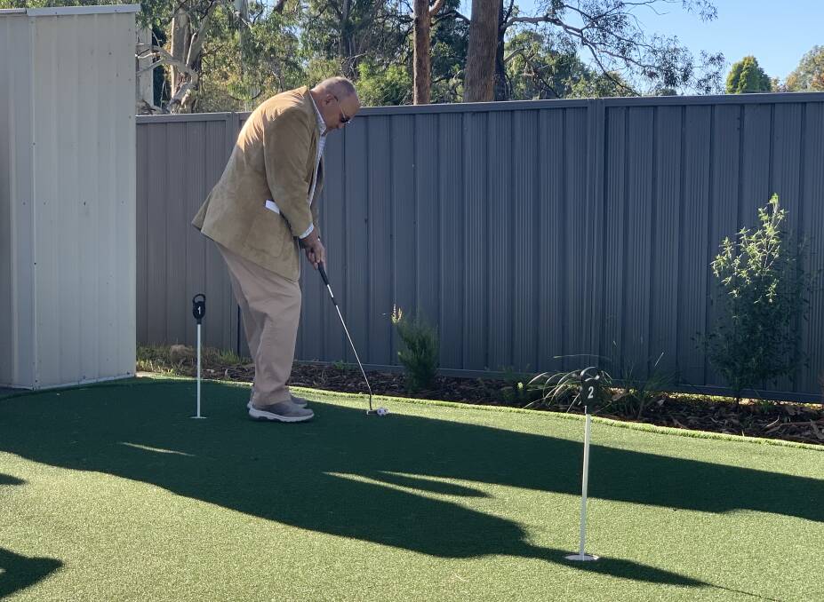 Adult day centre unveil new putting green