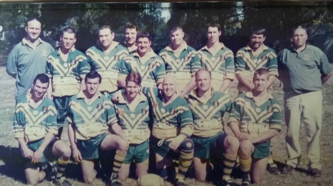FOREVER A LION: Andrew Bayliss with his Mittagong Lion firsts grade squad in the early 2000s. 
