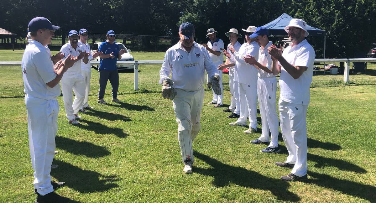 ULTIMATE HONOUR: Bowral Cricket Club legend, Greg Cruger was given a guard of honour by his team on his 150th game. Photo: Bowral Cricket Club. 
