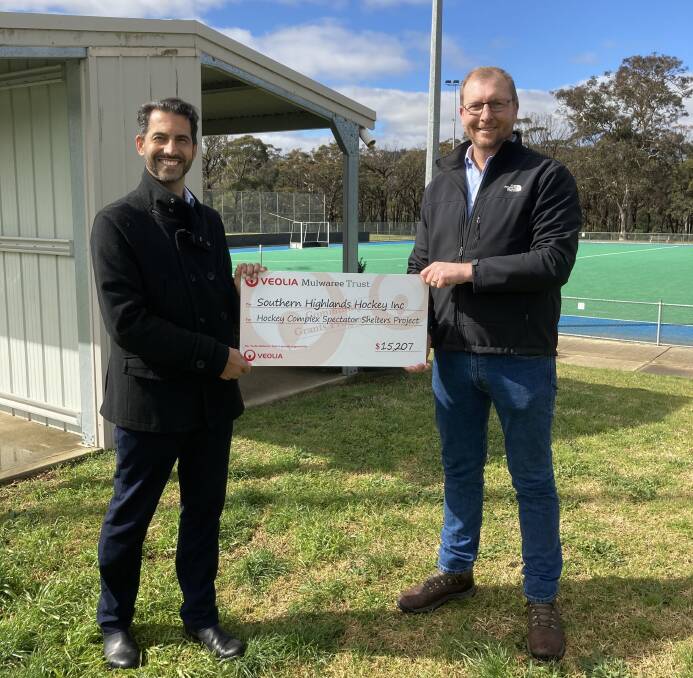 EXCITING TIMES: Veolia Mulwaree Trustee, Justin Houghton (right) handing president of the Southern Highlands Hockey Association Paul Sabatier the $15,207 cheque. Photo: Supplied. 