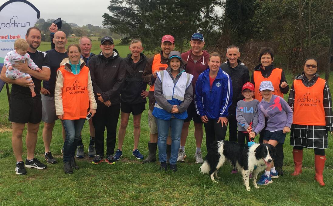 CELEBRATION TIME: The rain didn't keep these runners from celebrating Bowral Park Run's fifth birthday on Saturday. Photo by Matthew Welch. 