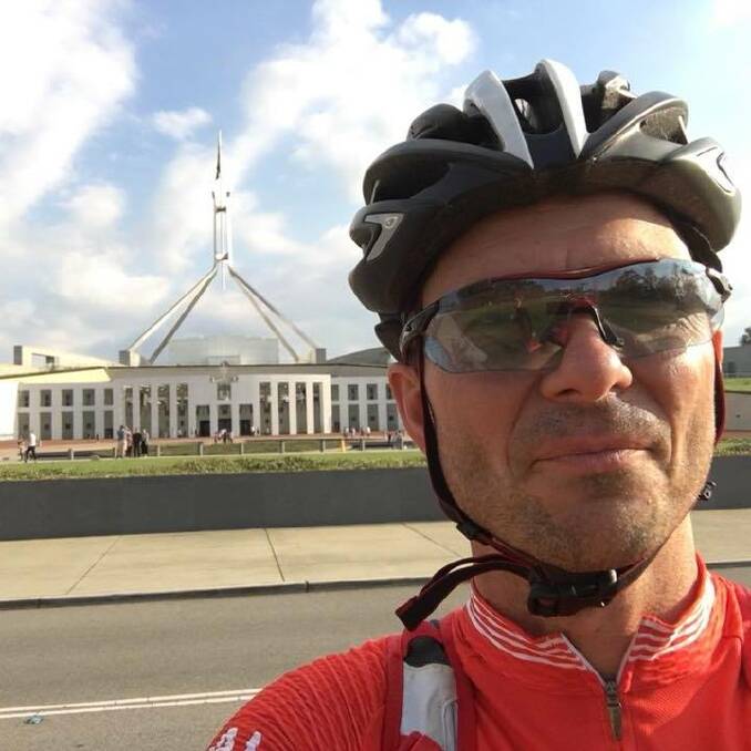DETERMINED: Robertson cyclist, Kev O'Meley is on the hunt for a pilot to ride with. He rode solo from Exeter to Canberra in a day with a mate in this picture. Picture supplied. 