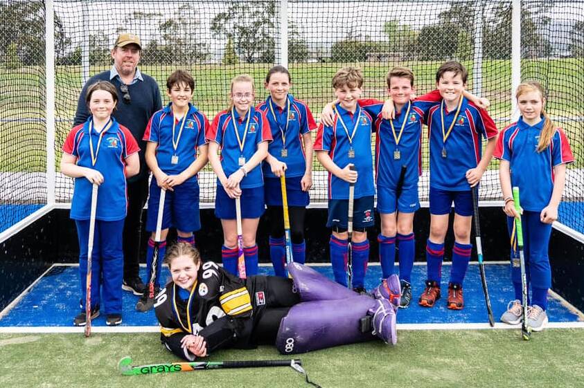 PERFECTION: The Burrawang Blues under 11 hockey team went undefeated all season long and capped off the year with a grand final win. Photo: BBHC.