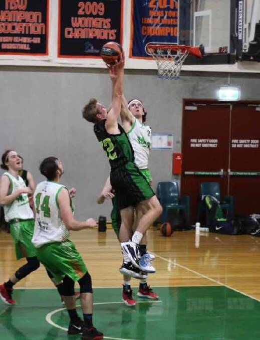 MEET YOU AT THE RIM: Tough defence on show by the Magic. An excellent, clean block denying the Bulls an easy lay up. Photo: Moss Vale Magic.