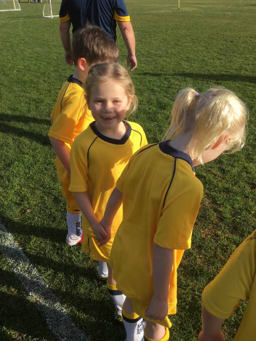 GOAL MACHINE: Oxley College's newest Hornet, Eliza scored a goal on debut and was all smiles. Photo: Supplied.