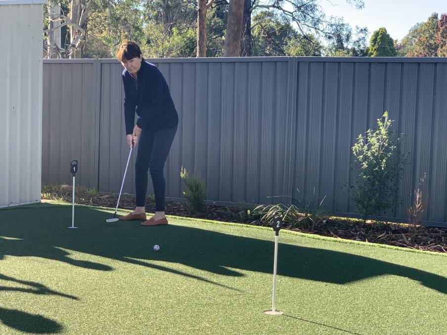 Adult day centre unveil new putting green