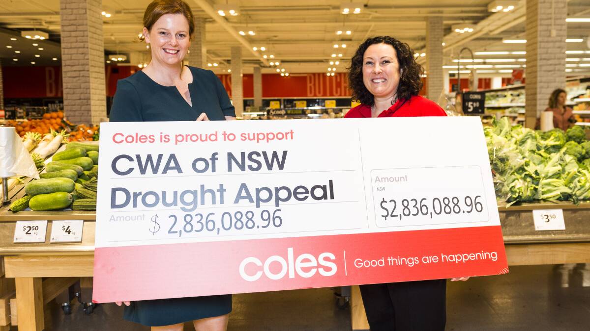 Coles State General Manager Emma Bridges presenting a cheque to the CWA of NSW CEO, Danica Leys.